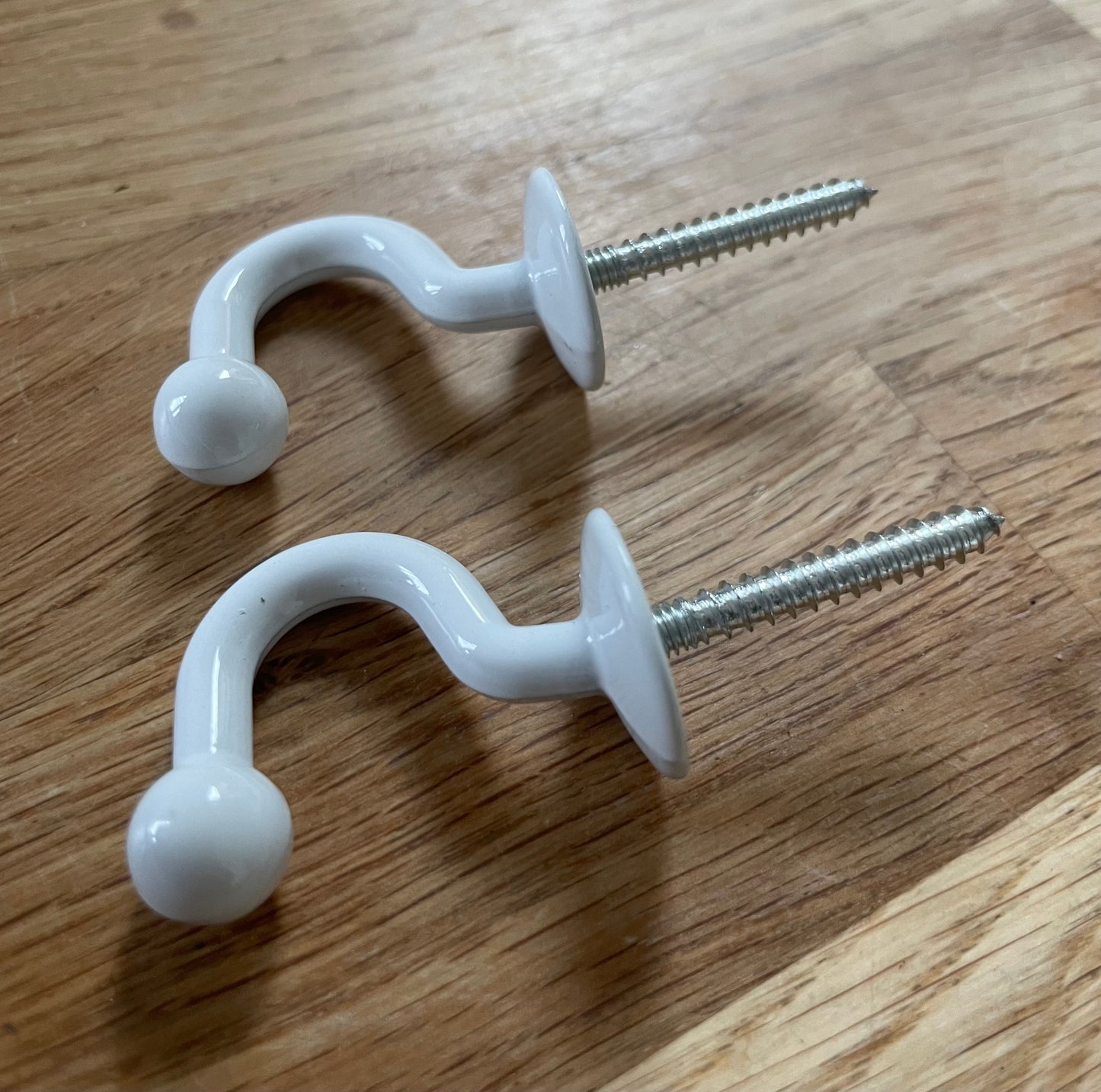 White curtain tie back hooks x 2